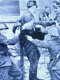 Body of Peter Fechter, shot at the Wall, is carried away, 8.17.'62