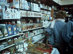 Easterners shop in a store filled with goods.