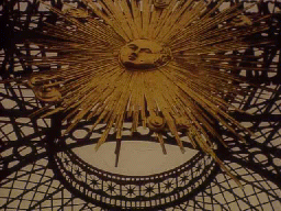 Wrought iron and gilded sunburst image at Sansouci