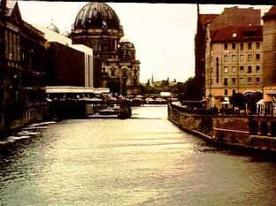 In the heart of Berlin, looking down the river Spree, old buildings left and right