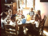 Seven children celebrate a birthday