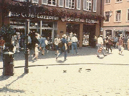 People walking in front of a cafe
